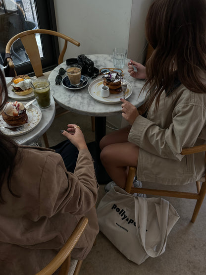 group of womens at a coffee shop with a tote bag