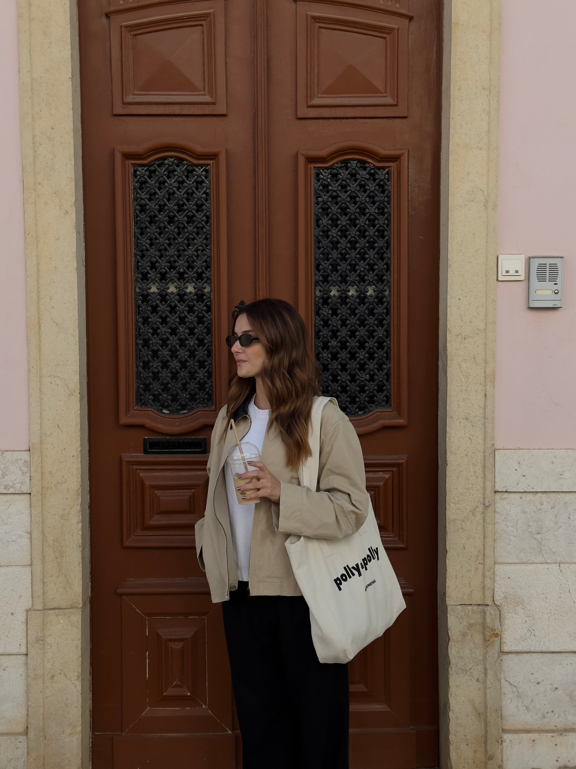 women having a coffee outside using a tote bag